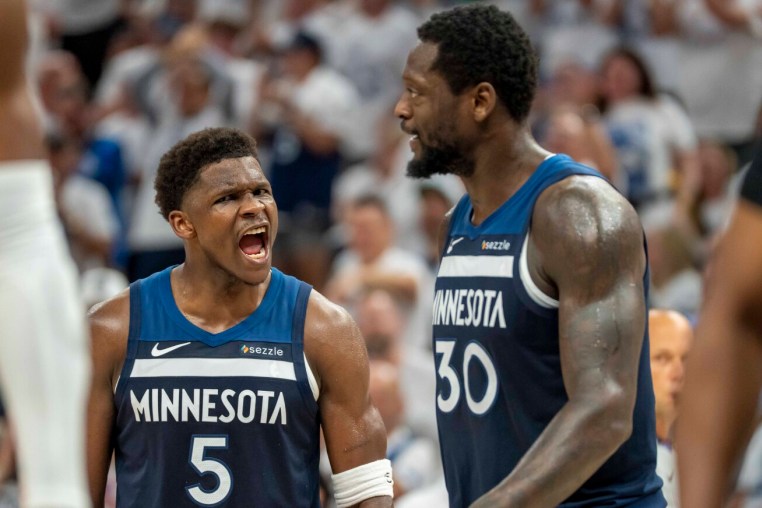 May 14, 2025; Minneapolis, Minnesota, USA; Minnesota Timberwolves guard Anthony Edwards (5) celebrates with Minnesota Timberwolves forward Julius Randle (30) after making a shot against the Golden State Warriors in the first half during game five of the second round for the 2025 NBA Playoffs at Target Center. Mandatory Credit: Jesse Johnson-Imagn Images